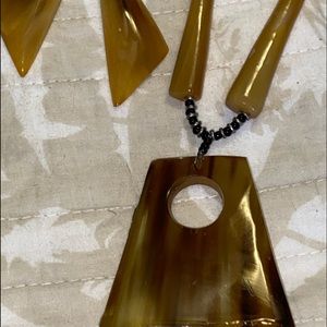 Costume necklace with matching are rings.